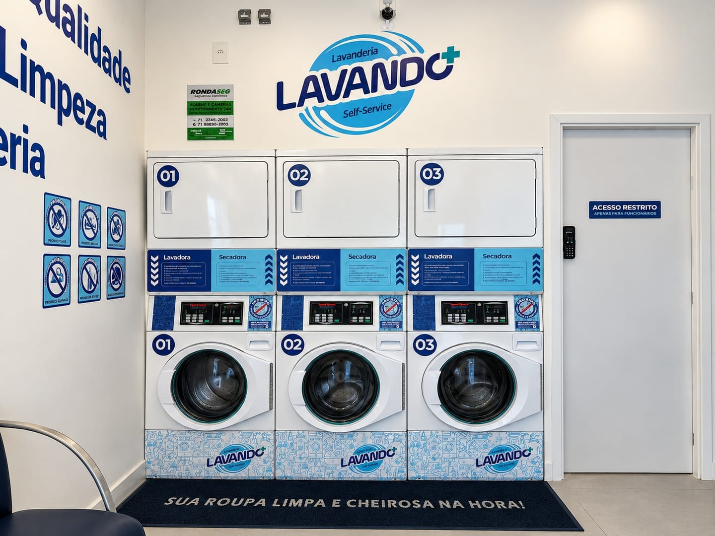 Washers 1, 2 and 3 at the bottom and dryers 1, 2 and 3 on top, above the mat that reads sua roupa limpa e cheirosa na hora (your clothes clean and fresh, right away)